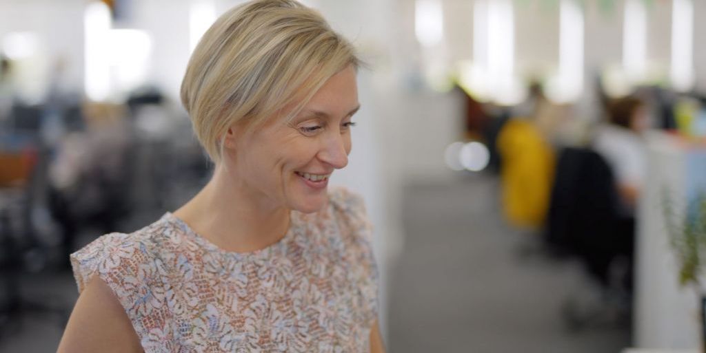 Charlotte smiling in the office