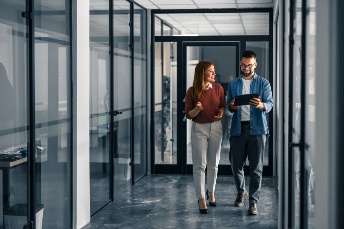 Colleagues_walking_down_corridor.jpg
