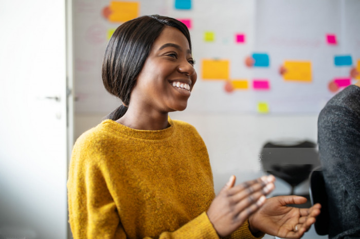 Colleague clapping in a meeting