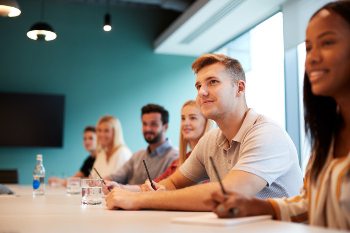 Colleagues listening in a meeting