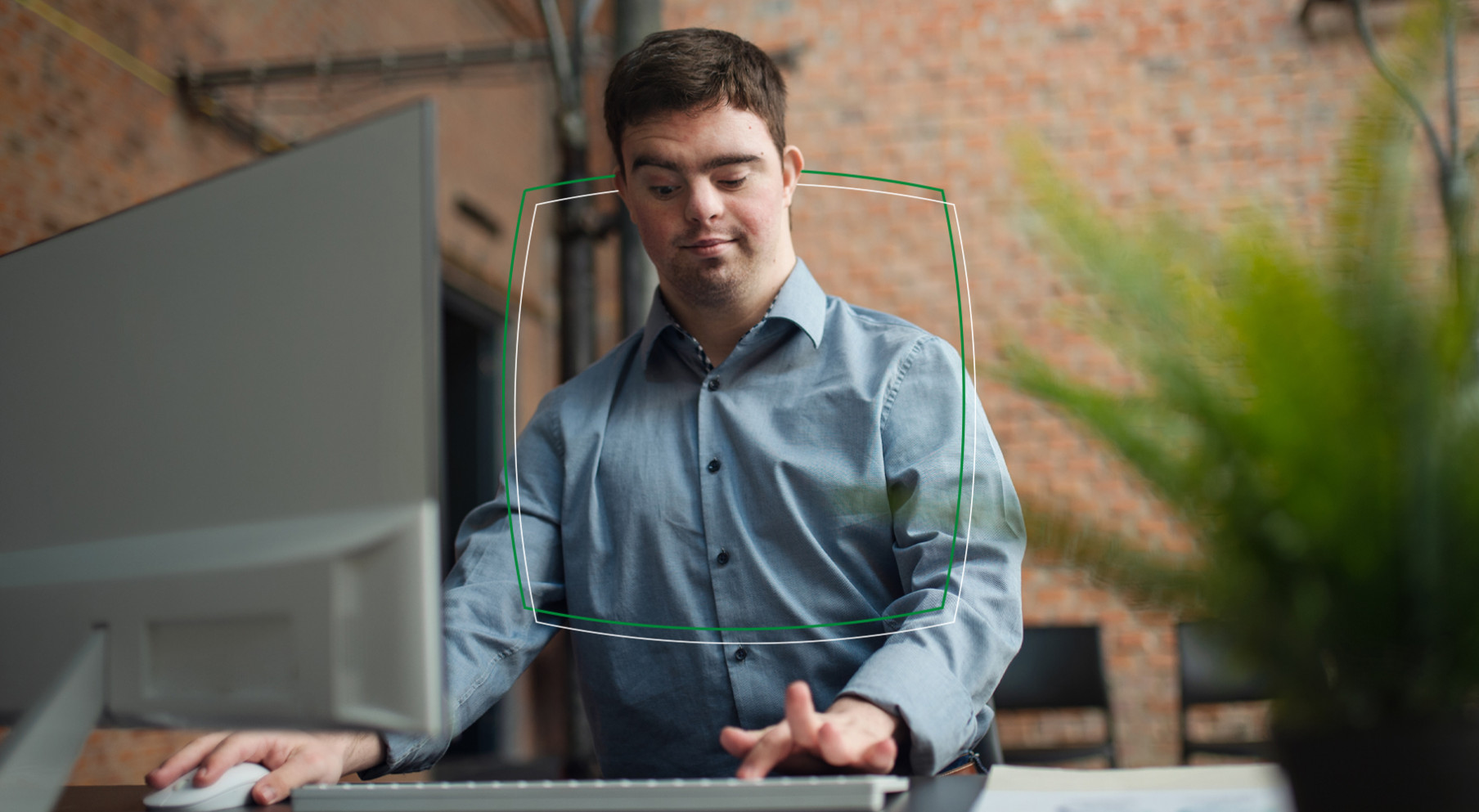 Colleague with disability working at a computer