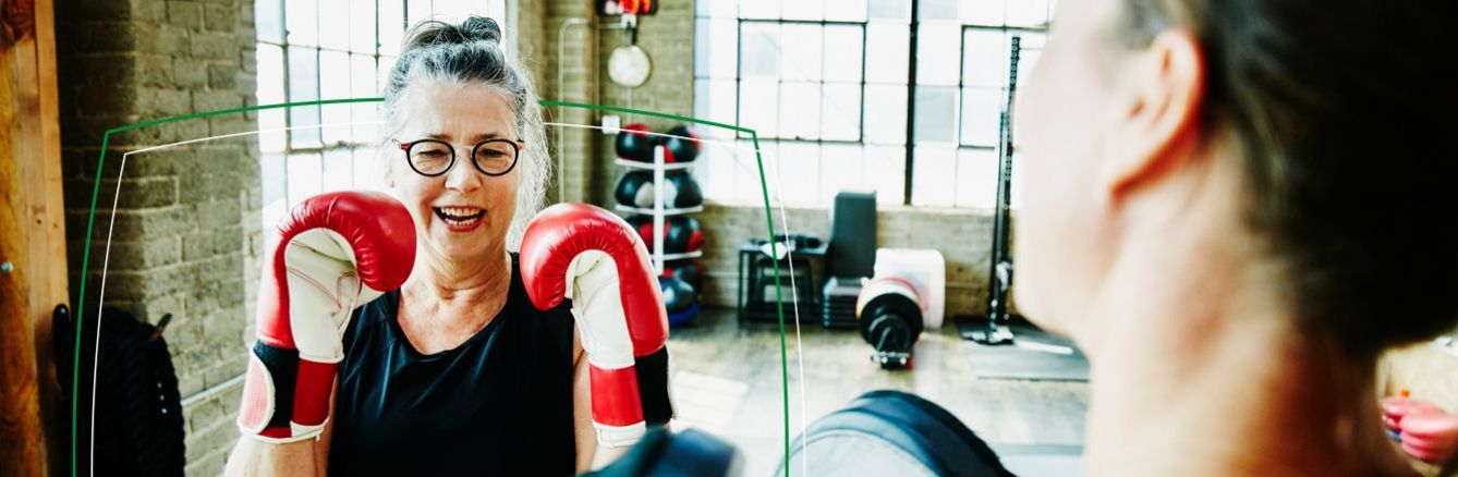 Two women boxing and smiling