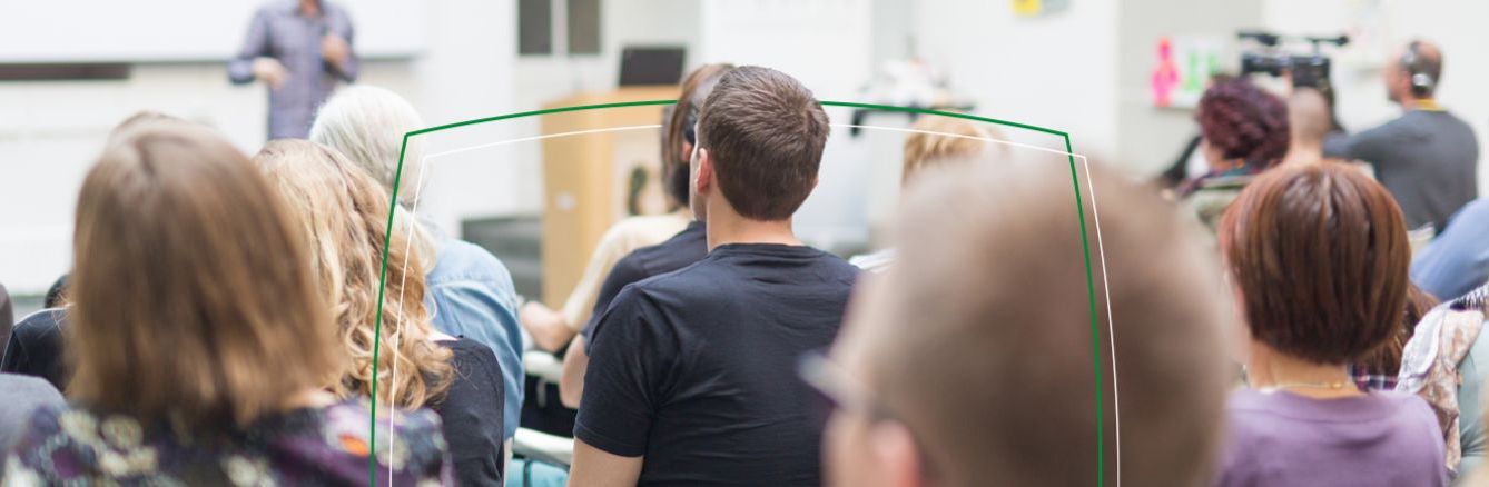 Colleagues listening to a speaker