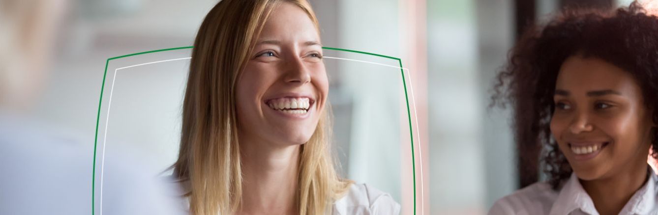 Two female colleagues smiling